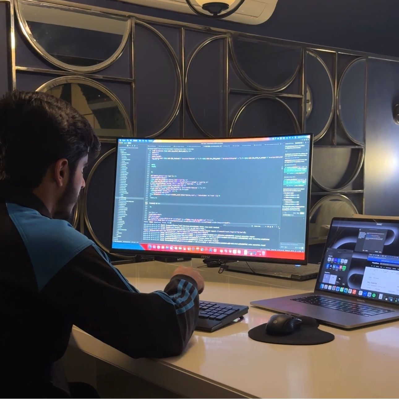 Taha at his desk